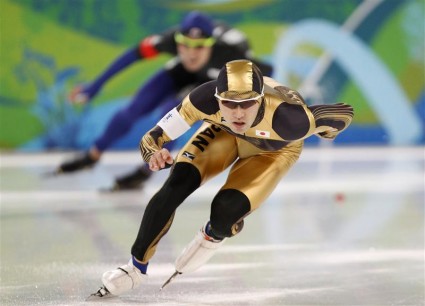 Nagashima of Japan and Lee of South Korea compete in the men's 500 metres speed skating race at the Richmond Olympic Oval during the Vancouver 2010 Winter Olympics